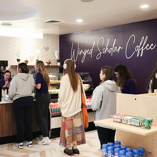 People getting coffee at Winged Scholar Coffee