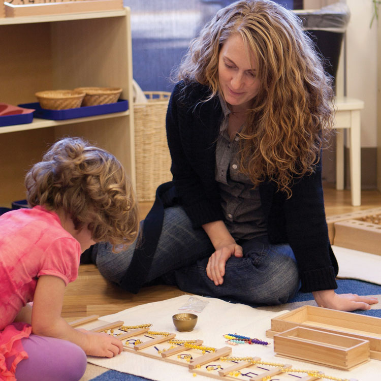 Student and Teacher in Montessori classroom