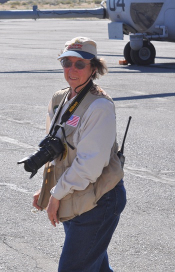 Betty Easley on strip with large camera