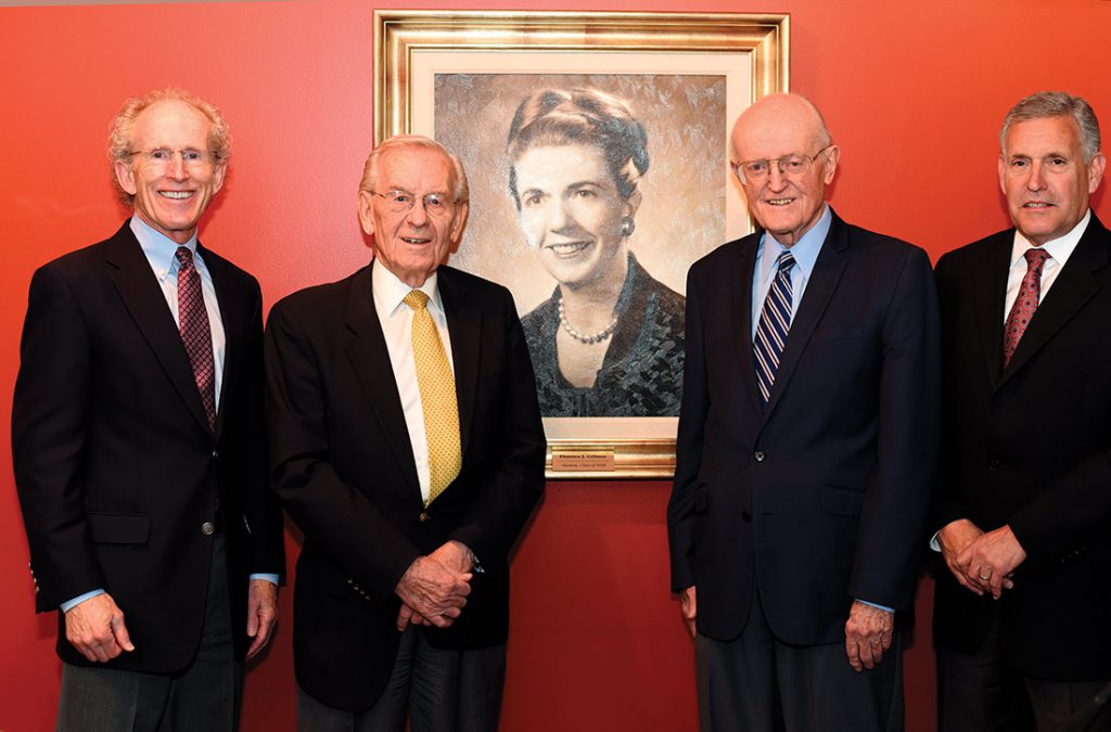 Four men around a photo of Florence J. Gillmor