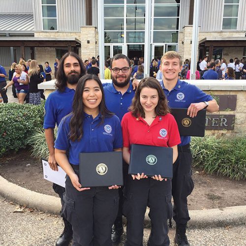 Janessa Ilada and others with their diplomas