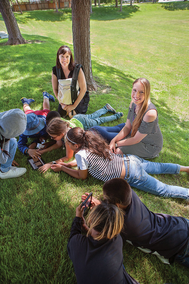 Students sitting on grass