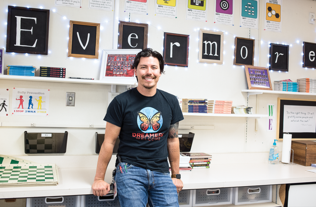 School of Education alumnus John Arthur poses in his classroom.