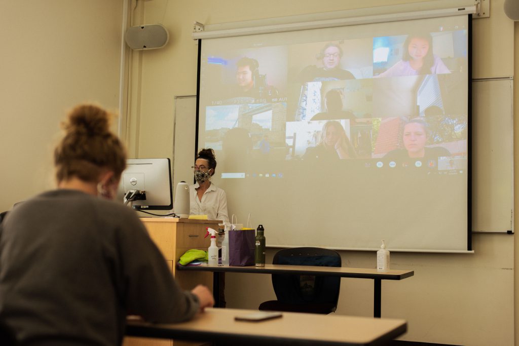 classroom with masks and zoom