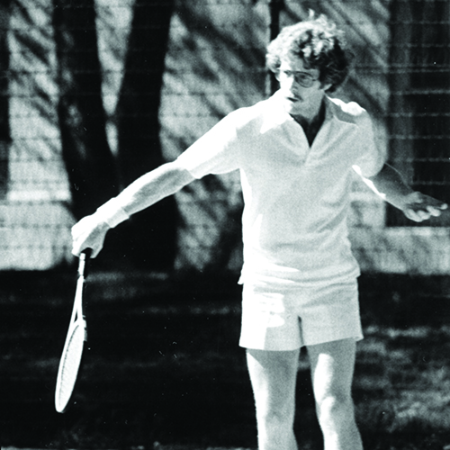 black and white photo of male tennis player 
