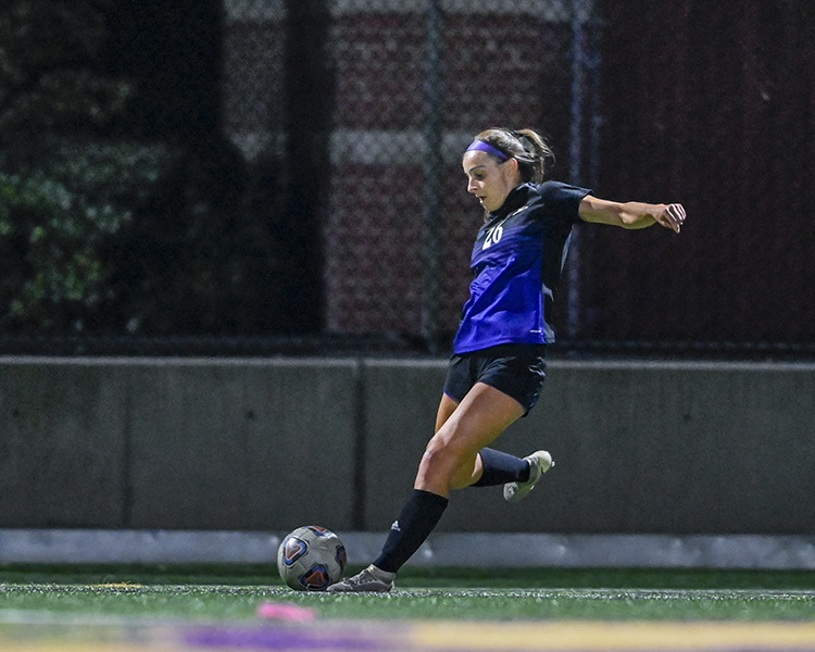 female Westminster soccer player about to kick ball