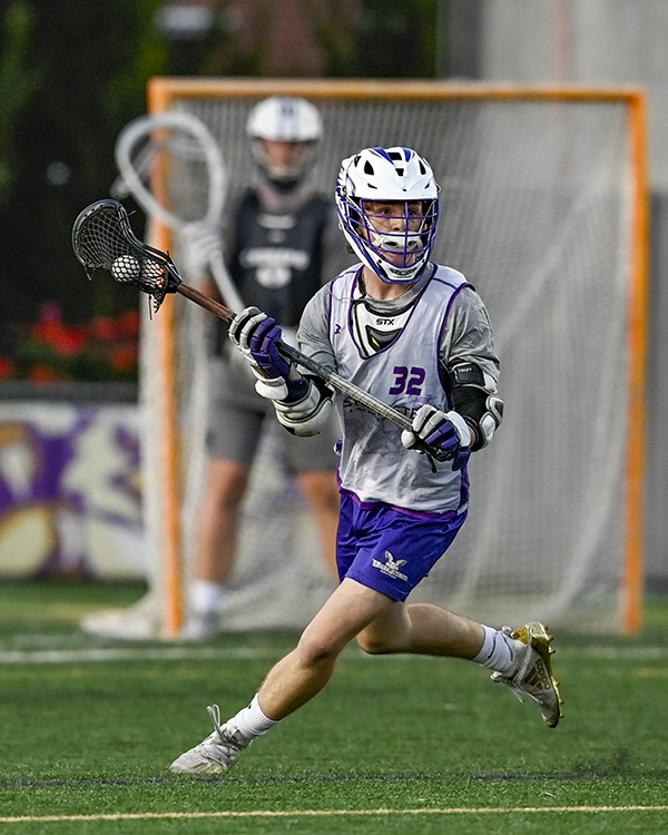 male lacrosse player on field