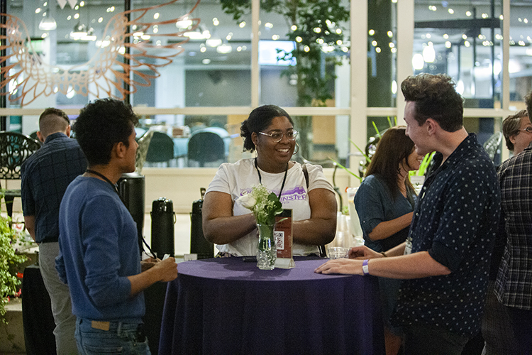 three alum sitting at table at Westminster Weekend