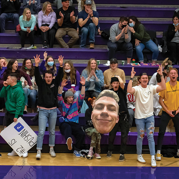 Westminster fans cheering in stands in gym